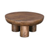 Three-quarter perspective highlighting the substantial drum-like tabletop and deep wood tones