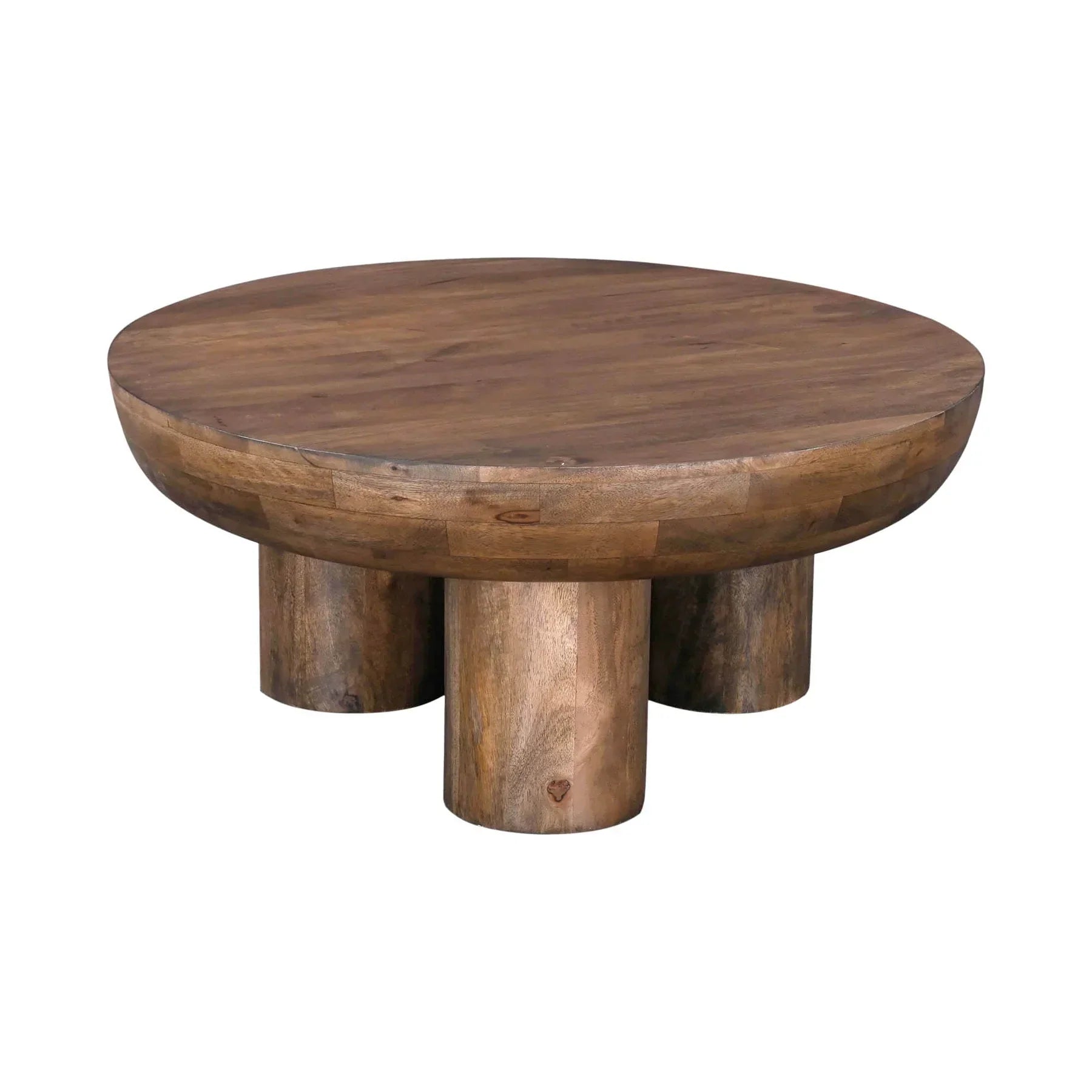 Front view of the Wilder round coffee table featuring a thick solid wood top and three chunky cylindrical pedestal legs