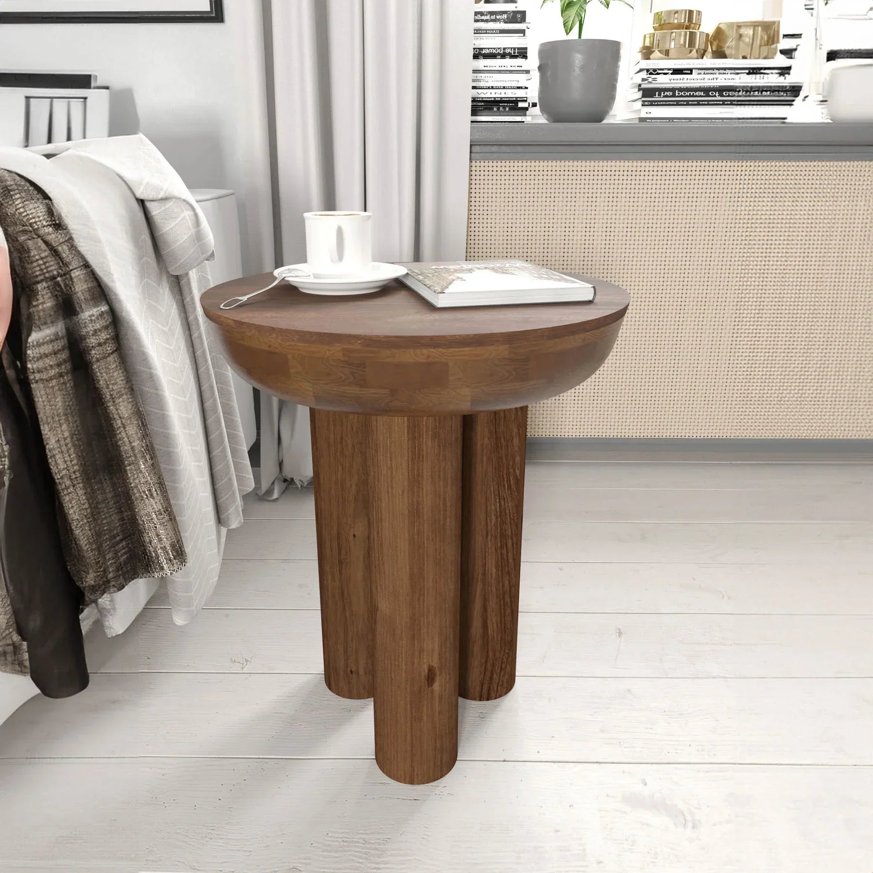 Lifestyle view of the Wilder table styled as a minimalist nightstand in a bright bedroom setting next to a white bed