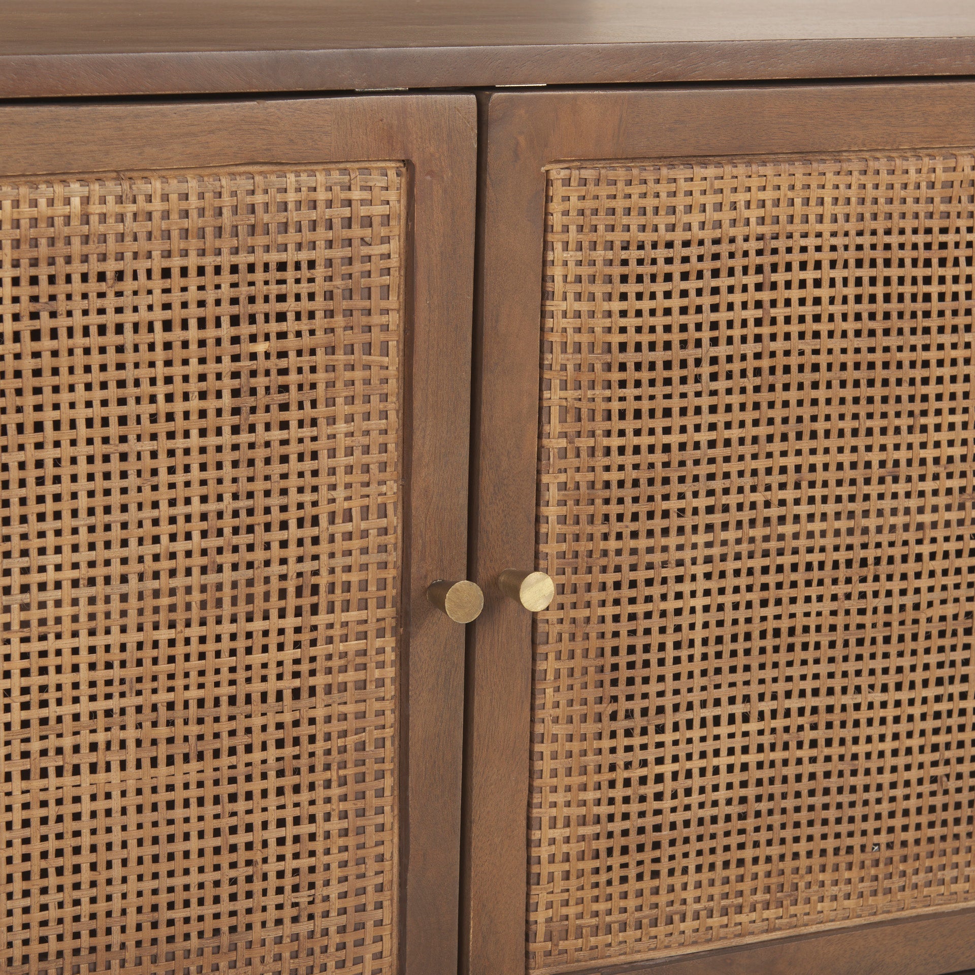 Macro shot focusing on the intricate woven cane pattern within the medium brown mango wood door frame