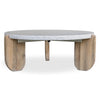 Front view of the Wunder coffee table featuring a thick circular white terrazzo top and three light wood sculptural legs