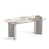 Three-quarter perspective view of the Yuki 71-inch dining table featuring a white ceramic top with bold natural veining and sleek grey tapered legs