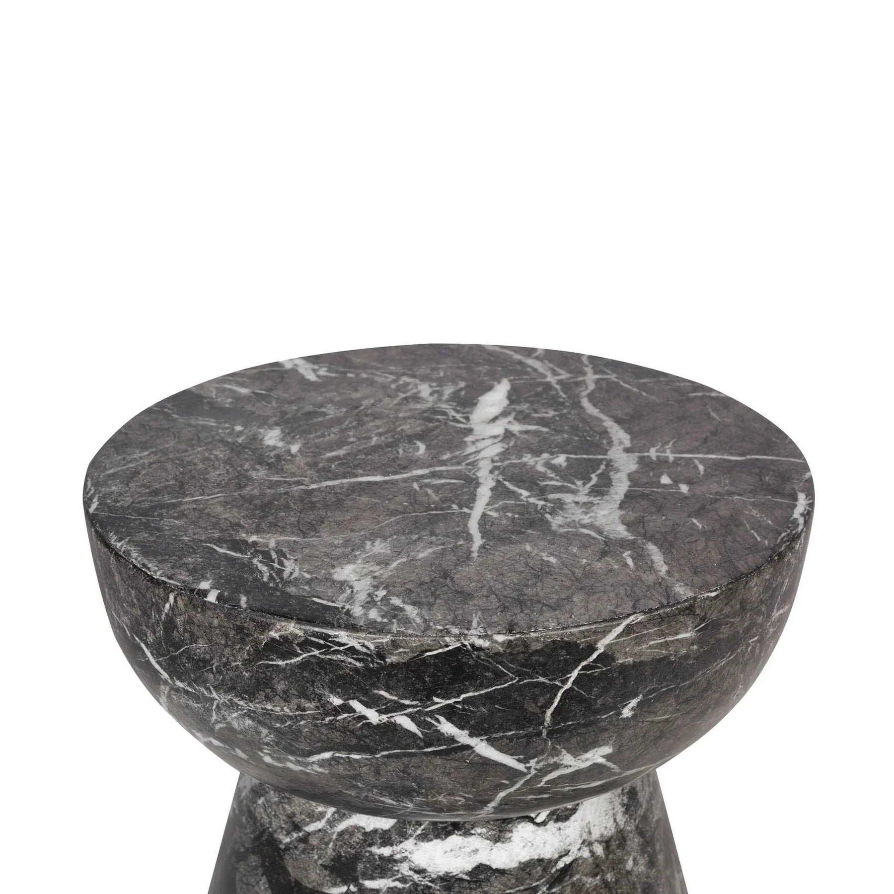 Three-quarter view of the Yves side table featuring a sculptural hourglass silhouette crafted from dark charcoal marble with prominent white veining