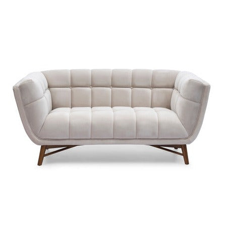 Three-quarter front view of the Stella Loveseat in cream boucle with a walnut-stained wood base
