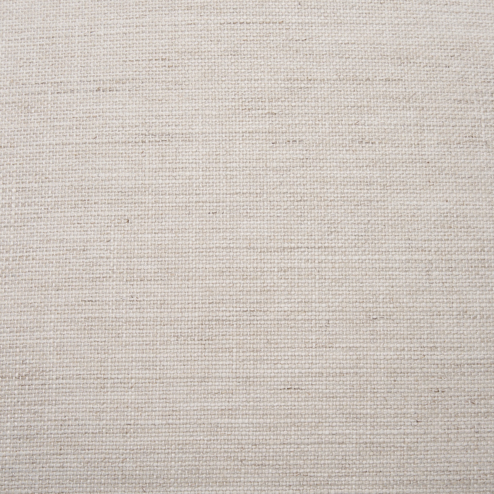 Front three-quarter view of the Gwynn pouf featuring a cream upholstered seat and a curved oak wood frame