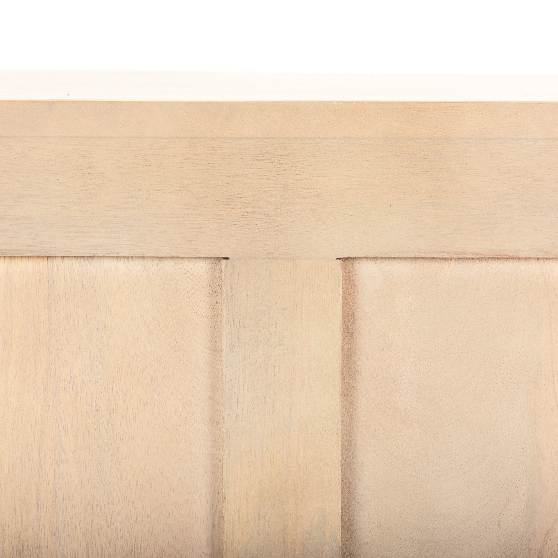 Front view of the Tucker sideboard featuring a natural light wash finish and four doors with elegant recessed arched panel details