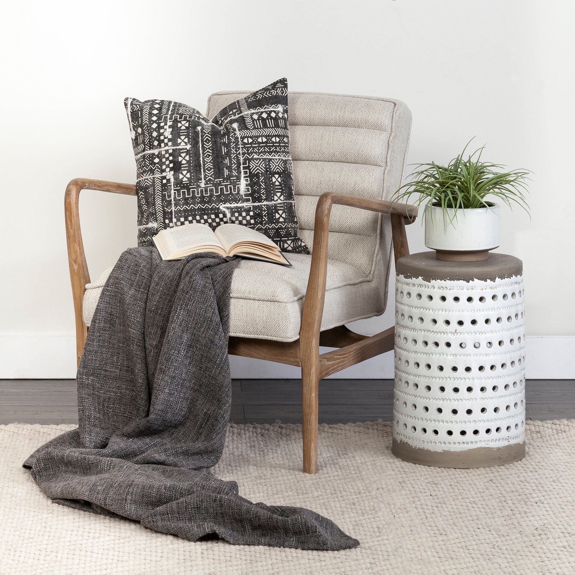 Front view of the Ajax Accent Chair in white textured fabric with a natural oak wood frame