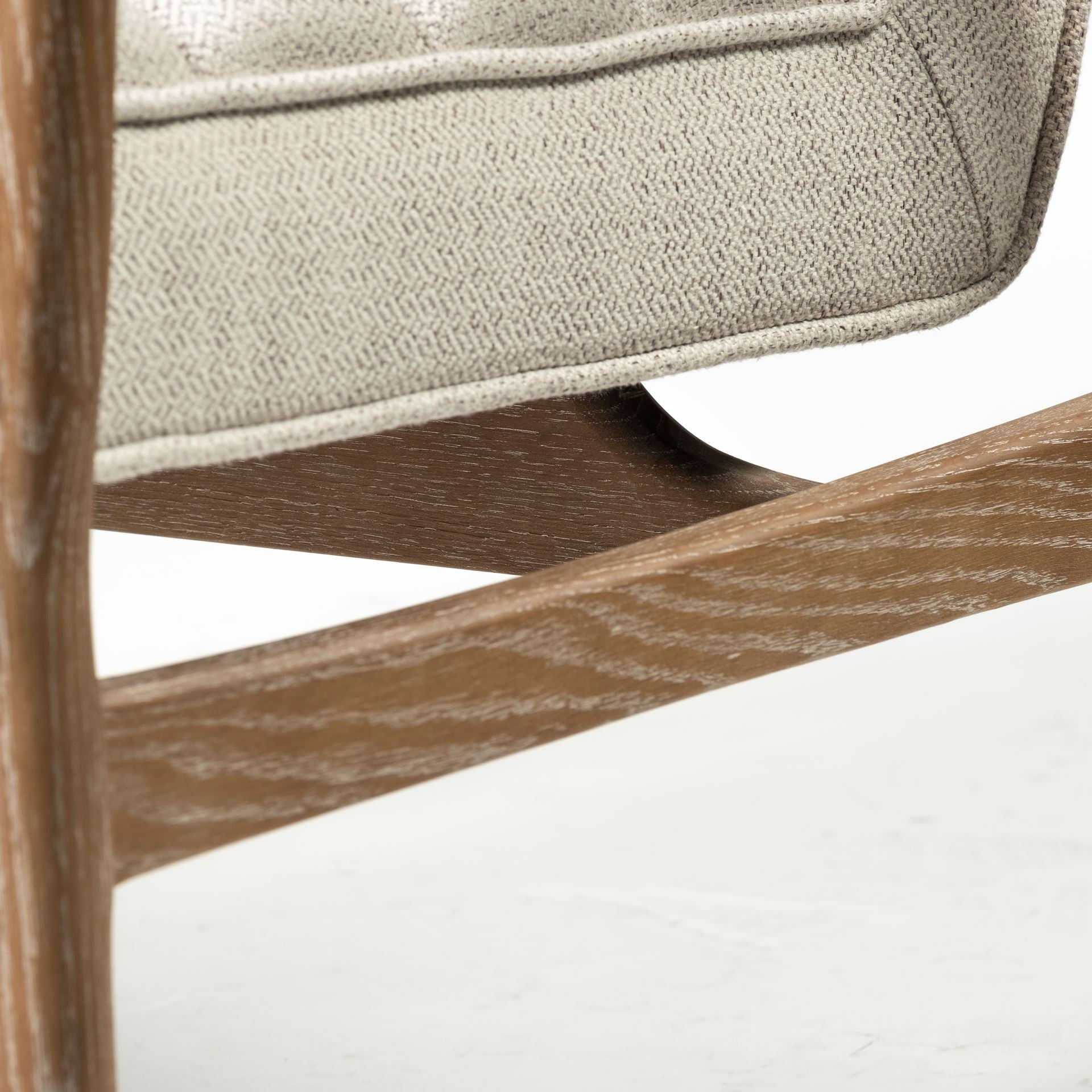 Front view of the Ajax Accent Chair in white textured fabric with a natural oak wood frame