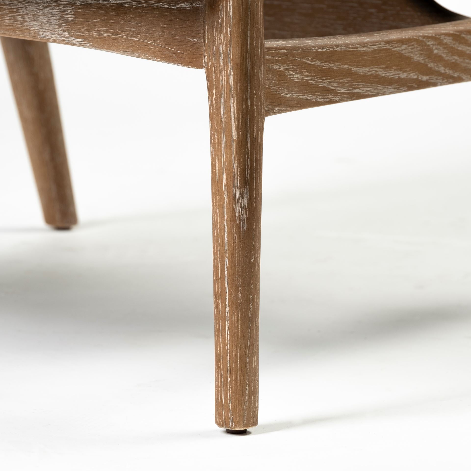 Front view of the Ajax Accent Chair in white textured fabric with a natural oak wood frame