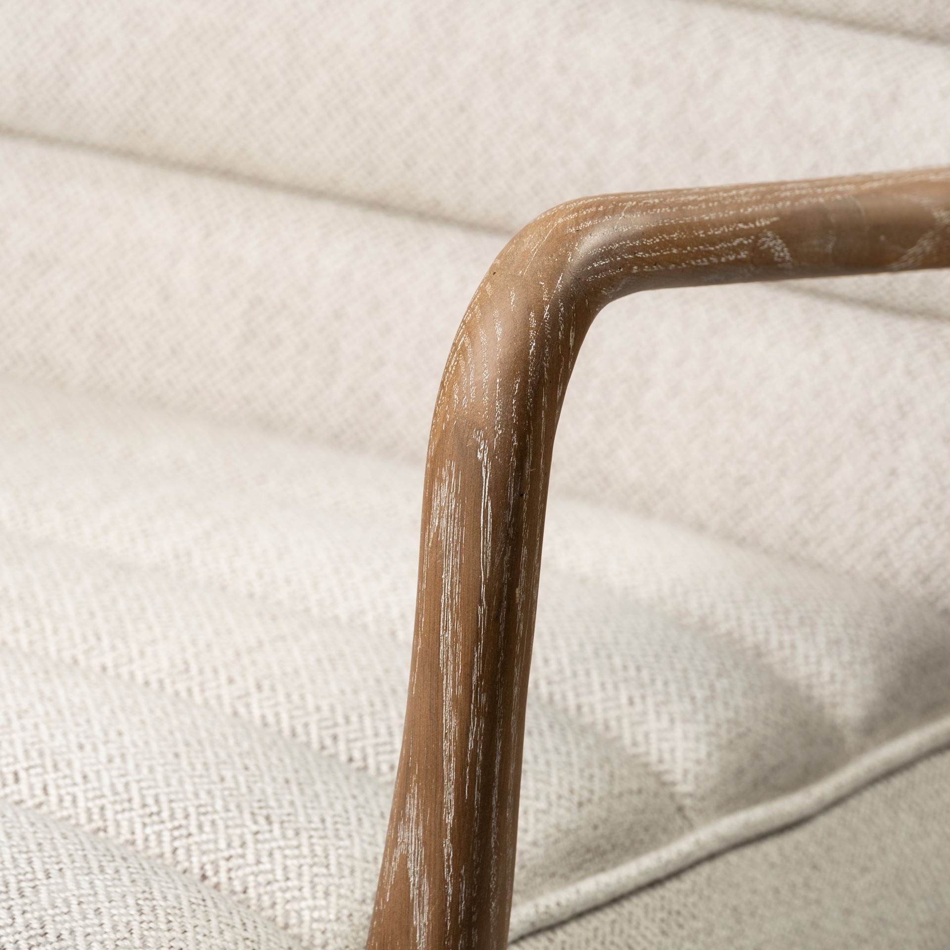 Front view of the Ajax Accent Chair in white textured fabric with a natural oak wood frame