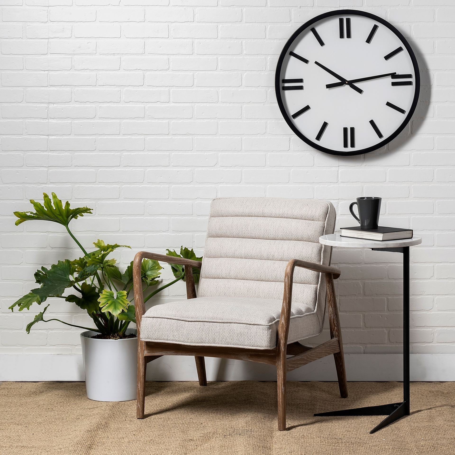 Front view of the Ajax Accent Chair in white textured fabric with a natural oak wood frame