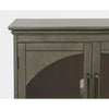 Close-up shot focusing on the traditional moulded top edge and the sleek metal door hinges