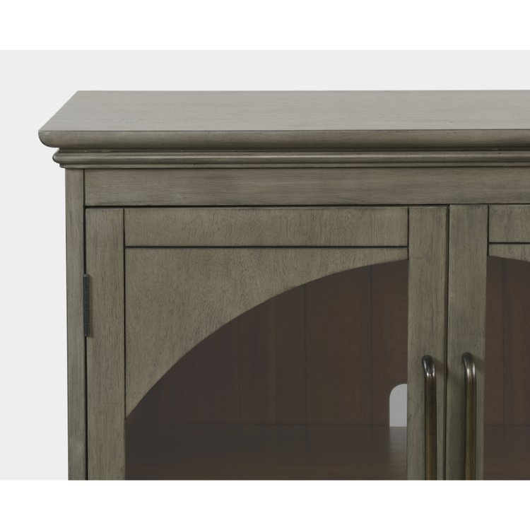 Straight-on front view of the Archdale accent cabinet in a weathered grey finish featuring four arched glass-front doors