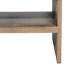 Detailed view of the interior shelf and lower base panels showcasing the sturdy wood construction and light sandy finish