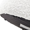 Detailed view of the stool's underside showing the neat fabric finish and the central mounting point for the base