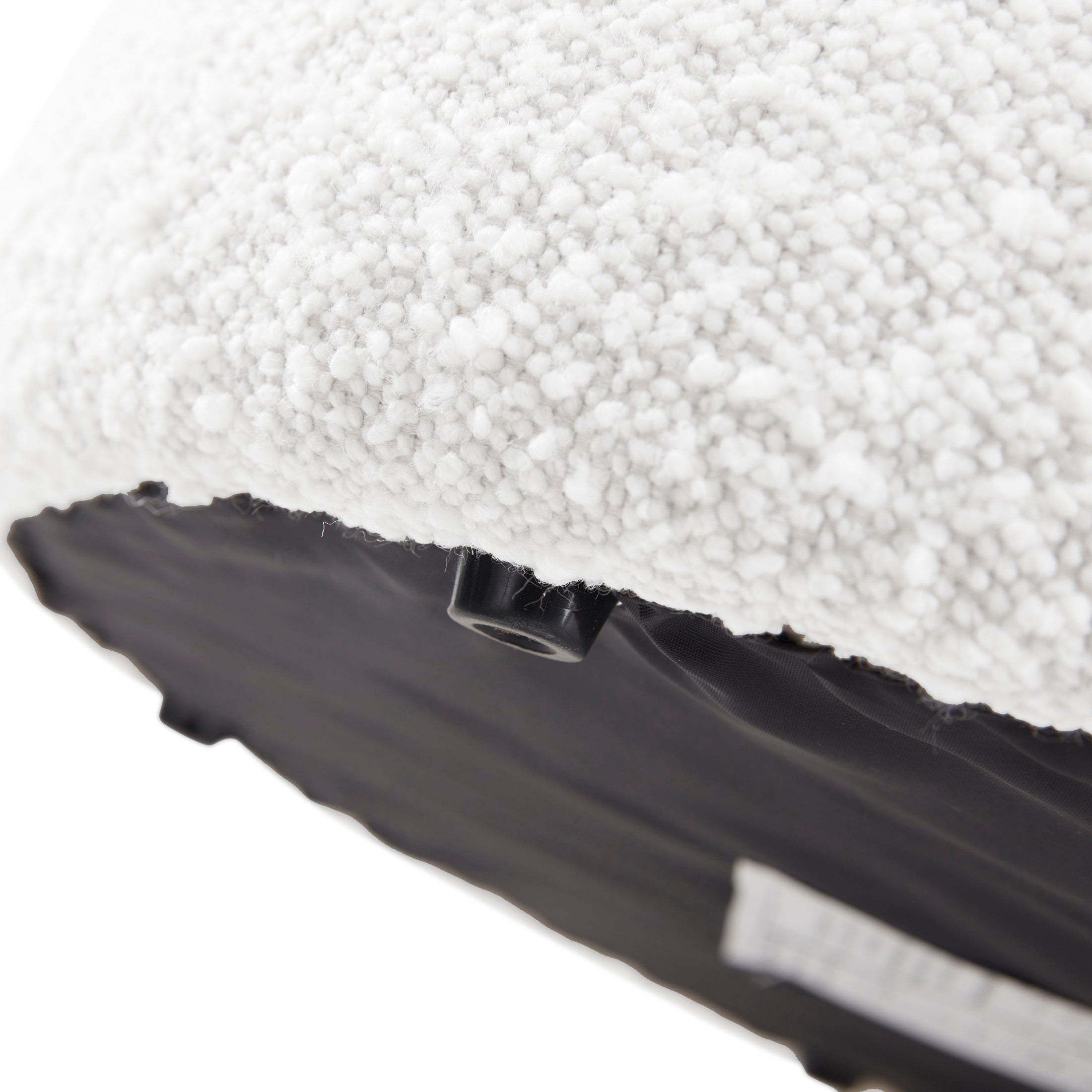 Front view of the Audo round stool featuring soft white bouclé fabric and a minimalist tapered silhouette