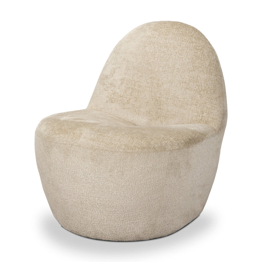 High-angle three-quarter view of the Beverly armchair highlighting its seamless, rounded organic shape.