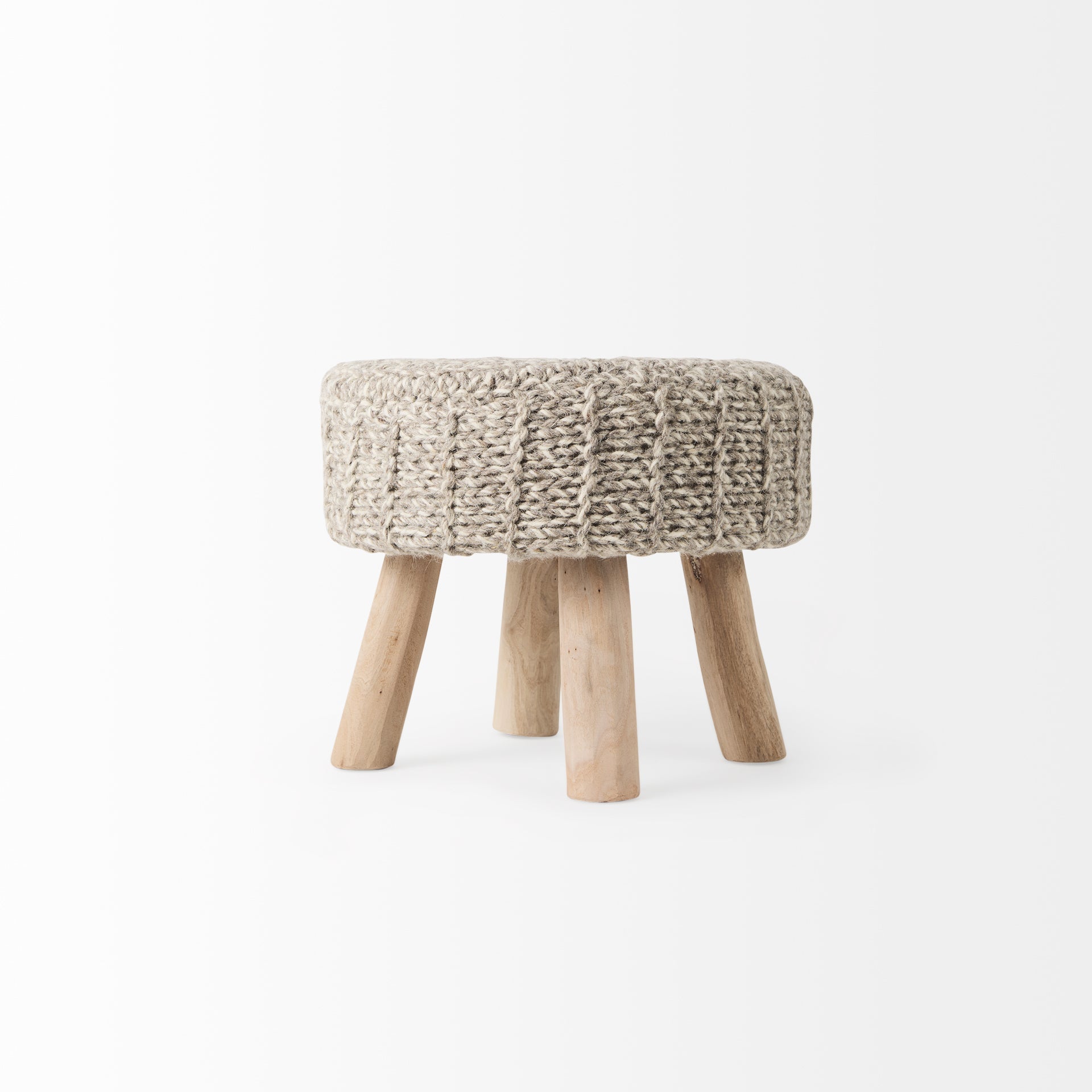 Front three-quarter view of the Bina accent stool featuring a thick gray knitted wool seat and four natural wood legs