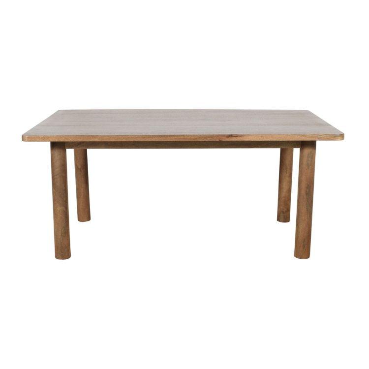 Front view of the Bodhi dining table in a light natural mango wood finish featuring a minimalist rectangular top and thick cylindrical legs