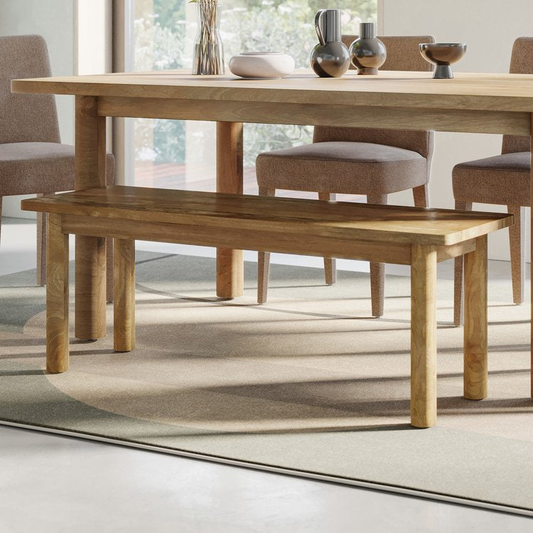 Front view of the Bodhi dining bench featuring a smooth natural wood finish and sturdy rounded legs