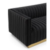 Close-up corner view of the black velvet Bretz Loveseat showing the plush upholstery texture