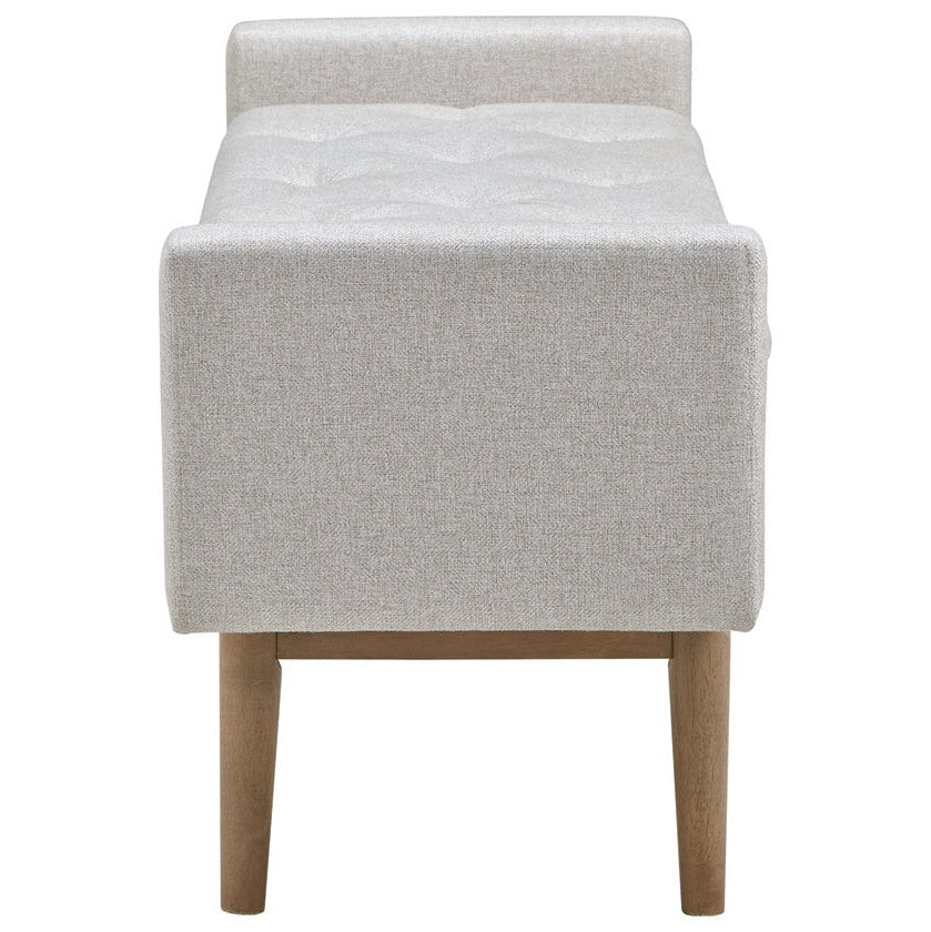 Front view of the Briarson storage bench featuring light gray button-tufted upholstery and natural wood tapered legs