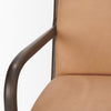 Detailed view of the dark wood armrest and tan leather seat on the Cashel chair