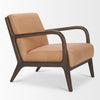 Low-perspective shot of the tan leather Cashel chair emphasizing its architectural design