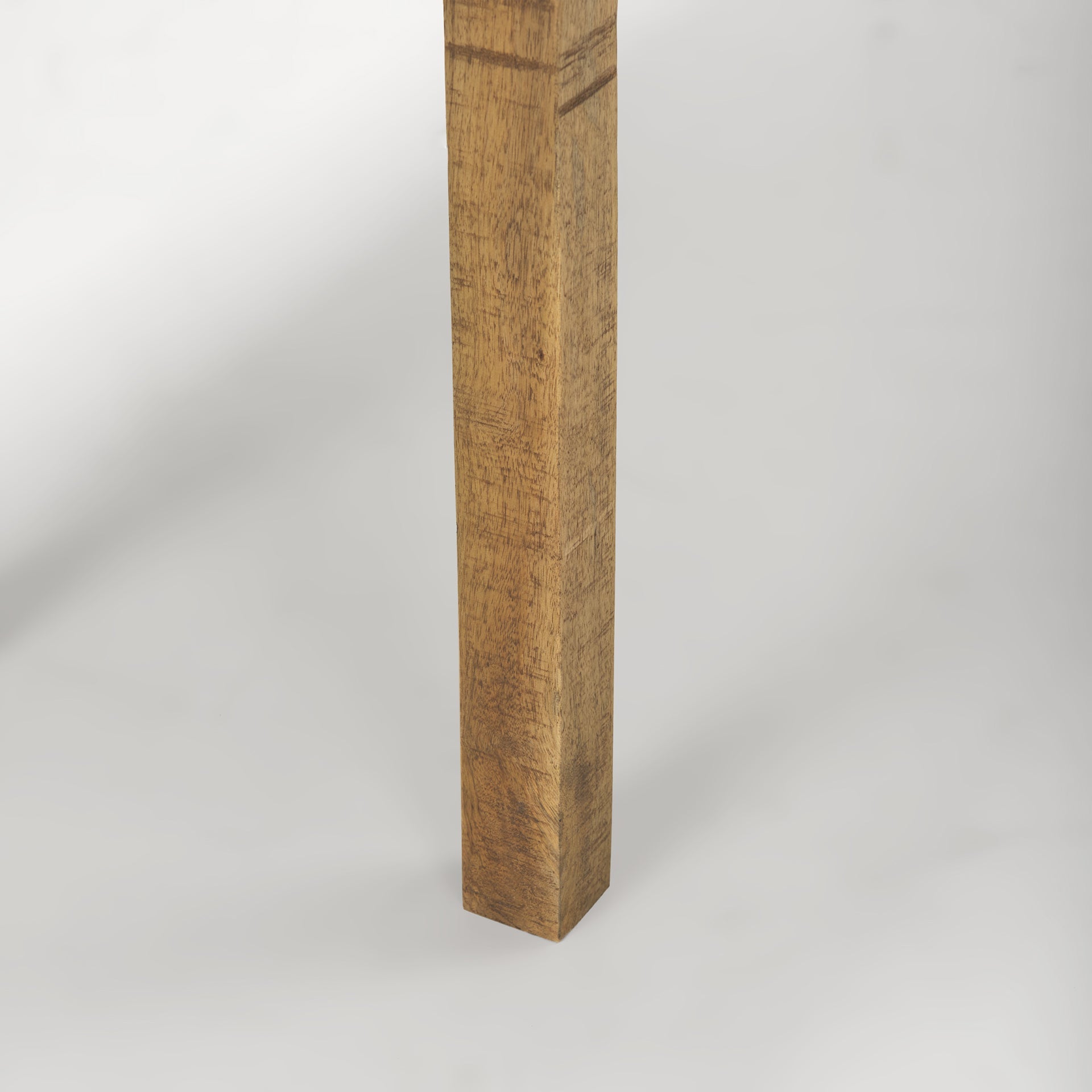 Front view of the Rosie console table in a light natural mango wood finish featuring a minimalist double-tier design