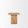 Low-angle shot emphasizing the solid construction and vertical wood grain of the fluted square pedestal