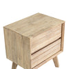 High-angle detail shot focusing on the high-quality wood joinery and clean-lined handle-free drawer fronts