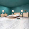 Wide lifestyle shot showcasing the nightstand as part of a complete Gia collection including a bed and dresser