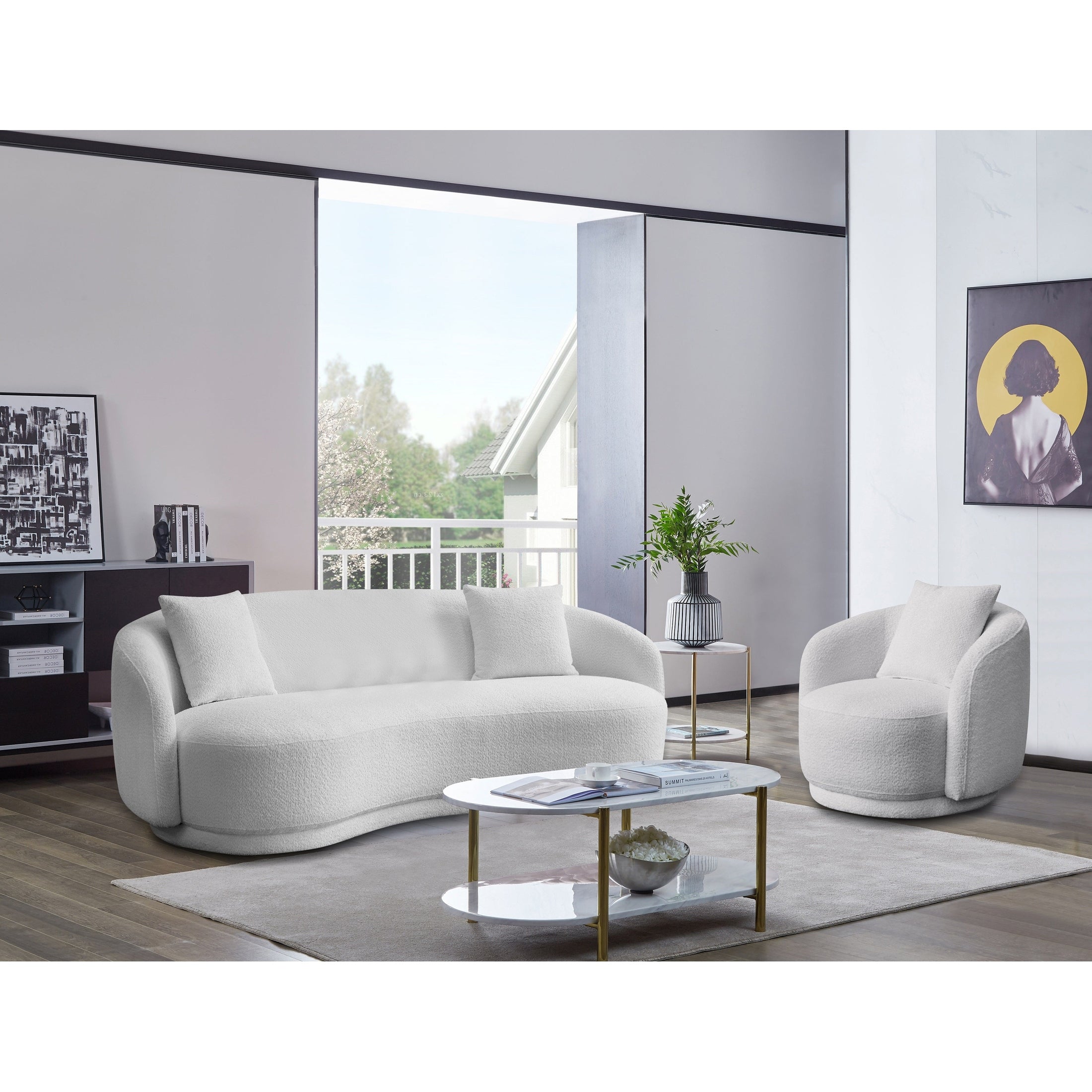 Front view of the Delano Accent Chair in white bouclé fabric featuring a deep circular seat and matching lumbar pillow