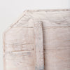 Faceted wood side table showing clean geometric lines