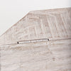 Detail of metal hinge on white wash storage table