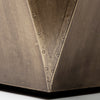 Detail of rivets on metal geometric side table base