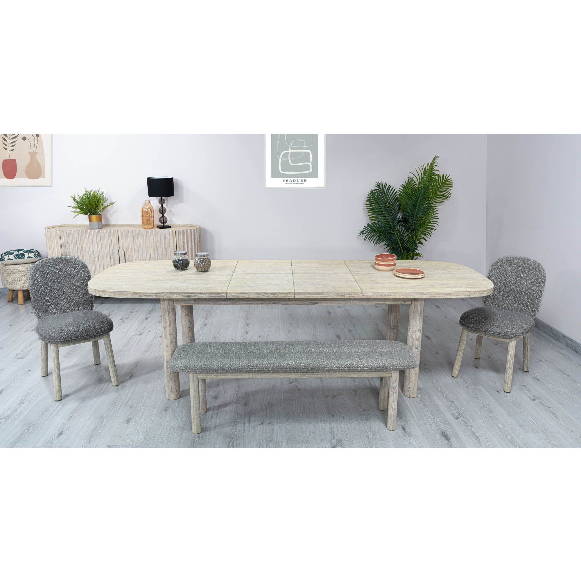 Straight-on side profile view highlighting the smooth oval tabletop and architectural wood construction