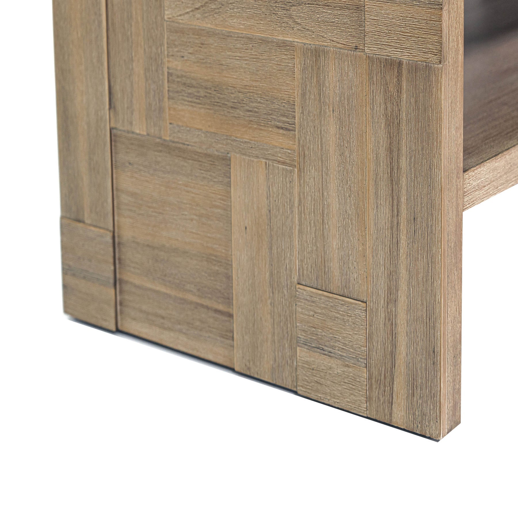 Front view of the Atlantis side table featuring a rectangular block silhouette with an open storage shelf and a light natural wood finish