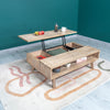 Lifestyle shot featuring the Gia table with the top lifted and styled with snacks in a contemporary room with a blue wall
