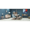 Lifestyle shot featuring the Gia bench in a minimalist studio setting with matching weathered oak furniture