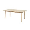 Perspective shot highlighting the uniform finish and solid construction of the Gia dining table