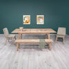 Lifestyle shot focusing on the coordinating natural wood bench and table in a contemporary dining setup