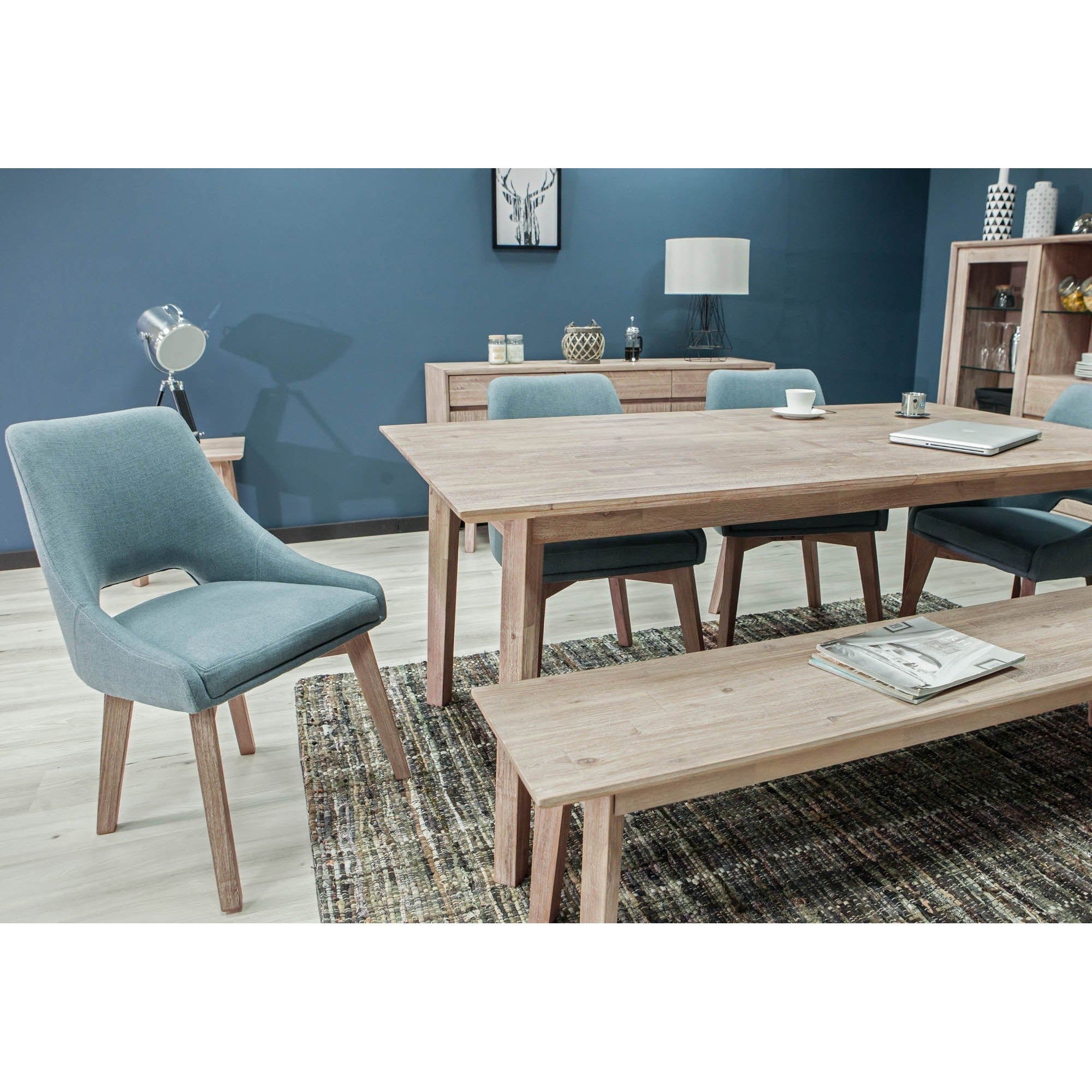 Front view of the Gia bench featuring a light weathered wood finish, rectangular top, and minimalist tapered legs