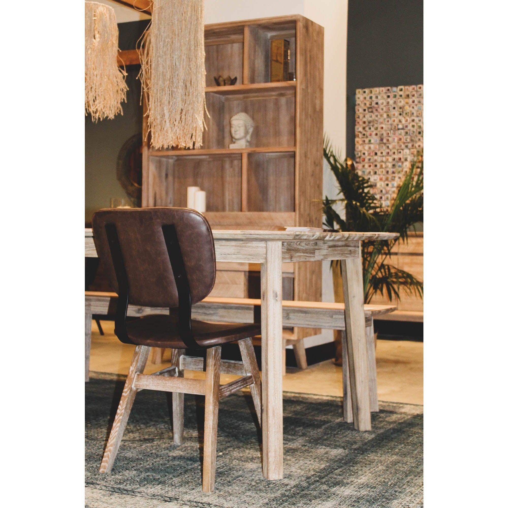 Front view of the Gia bench featuring a light weathered wood finish, rectangular top, and minimalist tapered legs