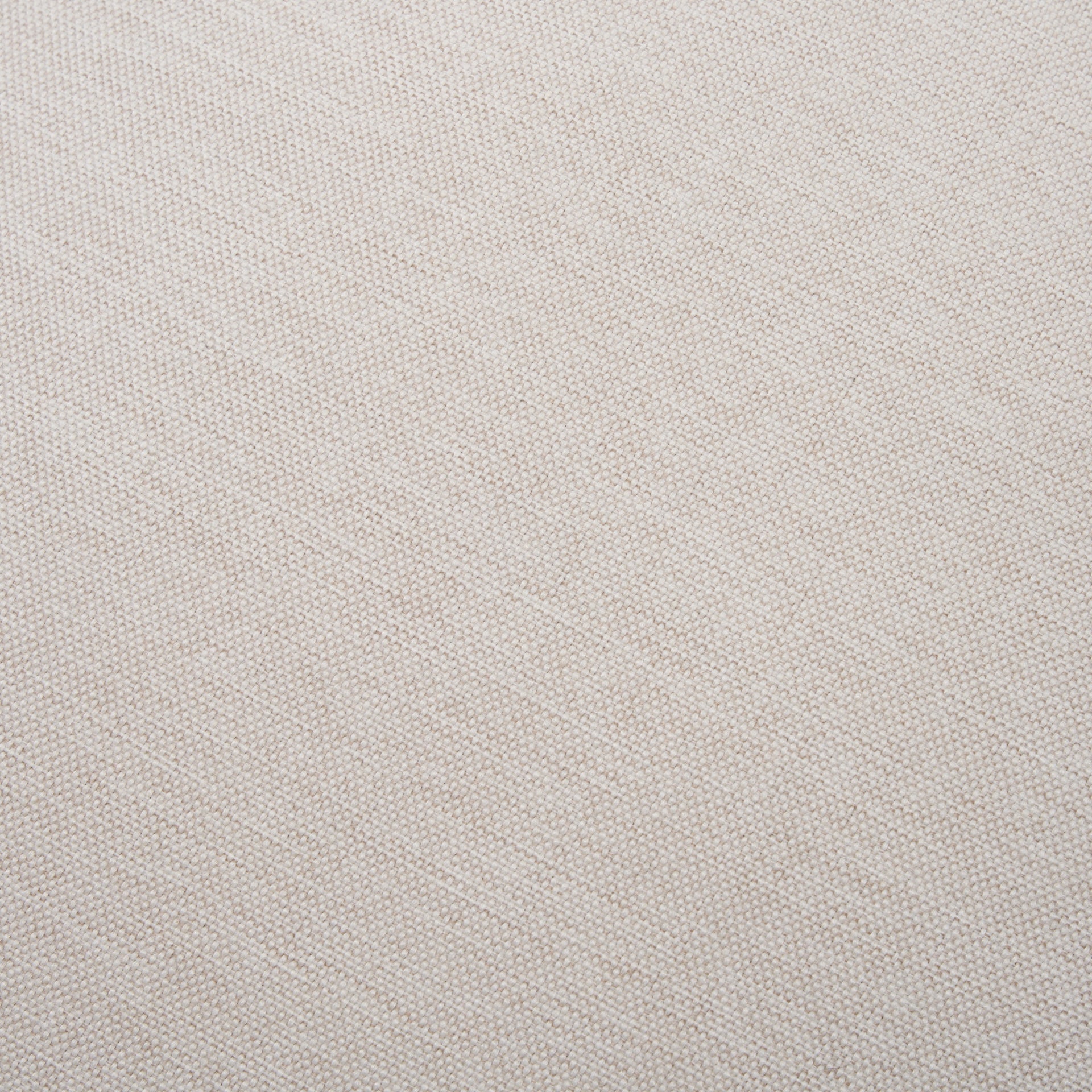 Front three-quarter view of the Gwynn ottoman featuring a cream upholstered seat and a curved oak wood frame