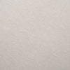 Macro detail shot showcasing the fine weave and soft texture of the cream fabric used on the Gwynn pouf