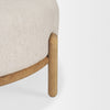 High-resolution close-up showing the precise fit of the cushion within the curved wooden leg supports