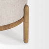 High-resolution close-up showing the precise fit of the cushion within the curved wooden leg supports