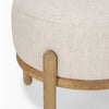 Detailed view of the sturdy rounded legs and the smooth natural finish of the oak wood frame