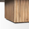 Macro view focusing on the vertical fluted grooves and texture of the solid wood pedestal base